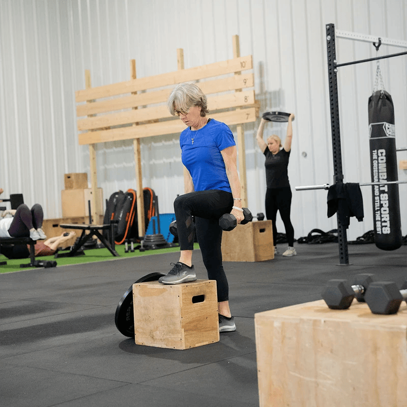 woman doing steps ups at Grow Strength & Training