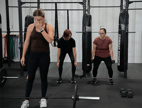 woman lifting weights at Grow Strength & Training